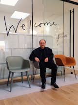 Designer Boris Berlin with his Fiber Chairs at Muuto's showroom in central Copenhagen. 

Of the Iskos-Berlin design, which carries on a strong modern tradition influenced by the Eames shell chair, Berlin says, “One of the most difficult and noble disciplines is to design without eccentricity." The chair's supernormal silhouette translates to different uses with four different bases (powder coated steel, sled, swivel, and wood), while the seat portion is 100% recyclable thanks to its eco-friendly composite mix using 25% wood fibers, 70% PP (polyproplene) and 5% coloured polyproplene.