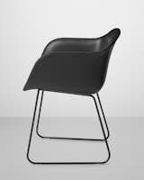 Muuto's Fiber Chair in black silk leather upholstery over black composite with sled base.
