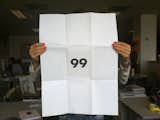 The other side of João's promo, as held by Julia, from of the series "Ninetynine."