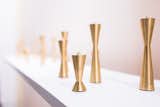 Designed by Ariane van Dievot, the Avandi Candlestix Candle Holder Set is a series of three sleek candlestick holders. Crafted in solid brass, each candle holder has a decidedly modern shape, and includes a pointed top for both securing a candlestick and stacking other holders in the series. Each candle holder has a leather base branded with the Avandi logo.