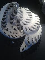One of the notable booth displays was the porcelain work of artist Jennifer McCurdy. She throws porcelain on the potters wheel and alters the form while it's still wet to acheive a sense of softness and movement. When the piece is almost hard, she carves designs into the clay.