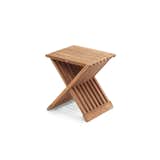 Crafted from versatile teak wood, the Fionia Folding Stool is a practical accent piece that can be used as a storage surface in a bathroom or, as a stool when applying lotion or makeup. The stool is constructed with hinges so it is easy to fold and transport to a new location, or put away for storage when not in use. When unfolded, the Fionia Folding Stool is a three-dimensional X-shape that is defined by the airy recesses between the teak strips.