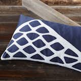 Stacked Stones pillows from Coyuchi: Made in India, this throw pillow features a hand-stitched appliqué and buttons made from coconut shells. Ideal for adding a graphic pop to your bedding motif. $115