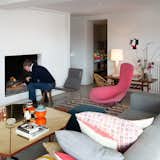 Renaud de Poorter lights a fire in his Bellum, Belgium, residence.  Photo 1 of 144 in Living Rooms by Dwell from A Cheerful and Modern Living Room in Belgium
