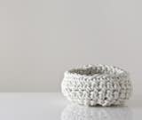 Neo's crocheted baskets are made of neoprene rubber, a material which is used frequently in plumbing and the motorcycle industries. $89 at Gretel Home.  Search “Bloomsbury-Basket-Weave-Throw.html” from Rubber-Made: 8 Great Interiors and Products
