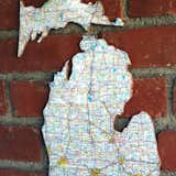 RECYCLED ROAD MAP CORKBOARD

It's true, foldout road maps are on the way out. Clean out your glove box and put those old maps to use. Recycled road map corkboards are a quick DIY gift idea for the beloved traveler, geography buff, or your college road trip partner-in-crime.