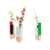 Designed by FX Balléry and available through A+R, the Pik's three connected vases perform an understated balancing act, while cheery accent colors and pale wood nod to Nordic design.