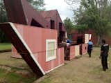It takes four people two hours to unfold the structure.  Photo 5 of 8 in Watch an Unassuming House Unfold into a Community Theater by Diana Budds