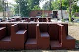 A detail shot of the church pew–like benches.  Photo 7 of 8 in Watch an Unassuming House Unfold into a Community Theater by Diana Budds