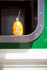 The window is outlined with a stainless steel portal that widens at the bottom to become a continuous transaction counter. 

Photo by: Meg Haywood-Sullivan  Photo 4 of 9 in Freshly Squeezed: Mobile Juice Truck Makes Its Debut