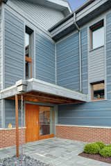 The entry sequence was designed to allow accessible entry, creating a sense of shelter and highlighting the thickness of the super-insulated ICF walls.  Photo 2 of 8 in Sustainable Living: Chicago’s First Certified Passive House