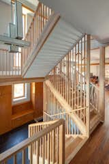 The American Yellow Birch-clad staircase was designed as a screen inspired by light filtering through a forest.

Photo by: Eric Hausman Photography  Photo 5 of 8 in Sustainable Living: Chicago’s First Certified Passive House