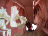 On the inside, the whale is decorated with drawings of the internal organs and a whale foetus. On one side of the whale there is a large opening where you can see whale’s white ribs, shaped like something in between ribs and the frame timber on a submarine.  Photo 6 of 8 in Imaginative Playgrounds by Monstrum