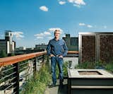 Fargo native son Doug Burgum stands on his rooftop deck. Landscape architect Brian Reinarts outfitted the space with local grasses and plants, LED-illuminated privacy screens, and a natural-gas fireplace.

Photo by: David Bowman  Photo 1 of 6 in Green Planning in North Dakota
