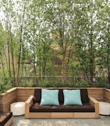 A sofa from Sutherland’s Poolside collection is covered in fabric from Perennials; the illuminated side tables are by Porcuatro for Tango Lighting. The screens are constructed from FSC-certified teak.  Photo 5 of 5 in Nelson Byrd Woltz Harnesses the Natural Elements