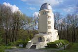Einstein Tower, Erich Mendelsohn, 1921, Potsdam, Germany.

The solar observatory at the Leibniz Institute for Astrophysics in Potsdam, better known as the Einstein Tower, is architect Erich Mendelsohn’s signature building and a paragon of German expressionism. As the first solar tower telescope in Europe, the building was intended to support Einstein’s study of relativity, and it continues to function as a research center today. Breaking away from the paradigm of rectangular post and beam architecture, Mendelsohn crafted an organic and sinuous form to reflect the new theories of the universe. The use of reinforced concrete to create a smooth, unified skin over the building’s brick substrate was innovative at the time and enabled its expressive plastic form. However, this experimental combination of materials has left the structure vulnerable to water infiltration that threatens the safety of its scientific equipment. A Getty grant will support an in-depth study of the building’s moisture problems, including the thermal stress of fluctuating seasonal conditions that is a shared concern among concrete buildings in temperate climates. Grant support: $48,000
