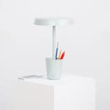 With its simple profile, the Cup Lamp is an unexpected multitasker. In addition to its primary function as a dimmable LED lamp, the aptly named lamp includes a storage cup at the base of the lamp. Designed to hold pens and pencils or other small knickknacks, the Cup Lamp is ideal for a desk or bedside table.