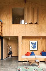Instead of relying on plasterboard that would be too costly, architect Davor Popadich chose to use plywood to line his New Zealand home's interior. In addition to being cost effective, the plywood highlights the builders' craftsmanship. We think he made the right decision. See more on the Popadich residence here.  Photo 1 of 10 in Ways to Use Benches by Diana Budds