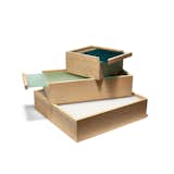The ObjectBoxes from designer Maya Bille allow you to both store and display items in one simple step. Each European wood oak box includes an acrylic sliding lid that has enough transparency to reveal the box’s contents, and enough opacity that the eye focuses on the color of the lid and the fine craftsmanship of the wood box.