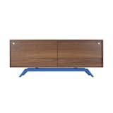 This streamlined credenza from Eastvold Furniture blends the appeal of walnut wood with cheerful additions of color in its powder-coated steel base.