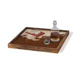 This eye-catching tray from eSSa Studios features a cowhide surface that is framed in walnut wood. It is available in three sizes.