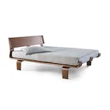 This platform bed is the first of its kind—it is comprised of sixteen layers of North American maple wood that is then framed in a warm North American walnut wood veneer.