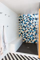 The shower is flanked by walls covered in Dal Tile in Arctic White.  Photo 6 of 8 in A Bright, Geometric Bathroom Renovation in Los Angeles by Erika Heet