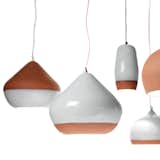TERRACOTTA PENDANTS

Tactile and organic, these handmade pendants combine kiln-fired terra-cotta with a shiny, white porcelain glaze.