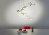 Designer Veronica Posada of Si Studio, based in Santiago, Chile, conceived Migration, a cluster of illuminated Origami-like lighting pieces.