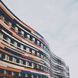 Colorful winding facade of a building in the Wilhelmsburg neighborhood in Hamburg, Germany.