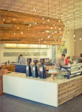 Fuse designed Verve's Pacific Avenue location concurrently and wanted to tie the two spaces together aesthetically. The salvaged douglas fir from Seabright also clads the counter at this space and was used on the shelving. The counter is capped in Caesarstone.