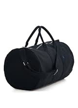 Ditch that old nylon duffel. This streamlined, heavy-duty canvas duffel bag is roomy, without being too bulky. It features handles and a shoulder strap, and is available in a sailor stripe pattern as well as a cool, solid black.