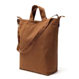 The Duck Bag is a durable tote that is reinforced for even your heaviest items. The chestnut color makes it a unisex option that can be used for groceries, books, or laptops. The bag includes an interior snap pocket for keys, phones, and other small essentials.