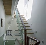 Milman Road Renovation: Staircase

The staircase, a marriage of new glass and old woodwork where the new handrail flows into the old, allowed light from the attic to flow uninterrupted to the ground floor. 

Photos by Syte Architecture  Photo 4 of 6 in Modern Renovation of a Classic London Home