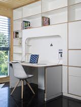 Office, Bookcase, Chair, Desk, Study Room Type, Library Room Type, and Shelves A built-in desk by NOEM FabLab folds into the wall when not in use.  Photo 8 of 9 in This Futuristic Prefab in Spain Has All the High-Tech Gizmos of a Spaceship