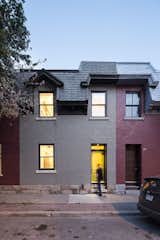 The outside of the home is illuminated at night. The crumbling slate roof was replaced with new composite tiles made from recycled rubber. The couple says their goal is to "help revitalize transitioning neighborhoods, one building at a time."