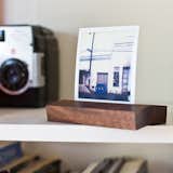The Stanley Photo Stand from Portland, Oregon’s Plywerk is a versatile solution for displaying photographs. The stand is comprised of locally harvested, hazard or salvaged western walnut wood from the Pacific Northwest. The two pieces of walnut are embedded with ultra-strong neodymium magnets that snap securely together to hold photographs, postcards, or even shopping lists. The Stanley Photo Stand can rest flat, curved, flipped, or split into two magnets and used on a refrigerator. Each stand is handmade in Plywerk’s Portland workshop and is hand-finished with a European-certified, child-safe, all-natural renewable oil and wax blend.