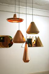 At the TENT London exhibition in east London, Dutch Designer David Derksen exhibited a collection of multi-faceted Copper Lights made from etched and folded copper sheets.