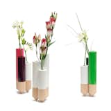 PIK vase by Y’a Pas Le Feu Au Lac

Created for Y’a Pas Le Feu Au Lac by FX Balléry, the PIK vases were inspired by stacks of hay. Each vase is comprised of a cluster of three colorful glass cylinders that finish in beech wood cone bases, creating a distinctive look for a tabletop or counter.