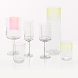 Hay Colour Glass The Colour Glass collection is a range of minimalist glassware by Scholten & Baijings. It includes high and low water glasses, a red wine glass, a white wine glass, a champagne glass and a carafe. The glasses and carafe come in in three different designs: with yellow or blue fading from the top, or a golden dot at the bottom of the vessels. The red wine glass comes with a pink square on one side, the white wine glass has black grid lines and the champagne glass features golden grid lines.

Find this item at the Dwell Store.