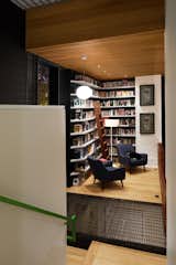 Due to zoning restrictions, the house's footprint had to be relatively small, so Svensen devised a solution: split levels. The library occupies a landing on the staircase and features shelves built by Atlanta's Dark Horse Woodwork.