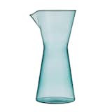 Kaj Franck's Kartio glassware sheds all things unnecessary and superfluous. The result is a timeless aesthetic that stuns with pure geometric shapes embellished only by gentle colors—as Franck put it, "the only decoration needed." Each perfectly balanced piece is simple, yet durable enough for everyday use, infused with the feeling that it could not have been designed any other way. The collection includes a carafe (shown) and small and large tumblers.