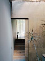 Oak veneer lines the stairwell in between the master bedroom and the children’s wing.