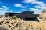 The house seems to claw onto the surrounding landscape, nestled on an outcropping with nearly 360 degree views of the surrounding desert.  Photo 16 of 23 in 20 Desert Homes from A Sculptural Desert Escape Inspired by a Shadow