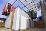 The 1,668-square-foot three-bedroom home is made of four colorful, crisscrossed containers equipped with a simple ventilation system that facilitates a constant breeze.