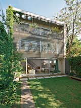 For a family home in the Coghlan neighborhood of Buenos Aires, Policastro used textured, rendered, and exposed concrete; aluminum; and wood to forge a three-story structure.