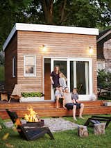 A coastal Massachusetts family used reclaimed materials to build this 168-square-foot multipurpose backyard space. The ADU doubles as an office for the dad, a playroom for the three kids, and when guests visit, it’s a place for them to bunk. The homeowners DIY’ed the construction almost entirely by themselves and completed the project for around $10,000.