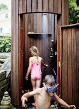 An outdoor shower was the family’s first construction project. “Doing the shower made us realize we can build things the way we want to build them,” says Meg.