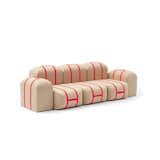 The plush poufs of this sofa system can be freely stacked and arranged. Each cushion can also be carried like a suitcase by its bold, bright orange strap.