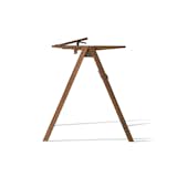 A modern reinterpretation of the traditional writing desk, this piece comes with top-storage compartments and legs that can adjust from 21 to 34 inches in height.